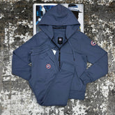 CNDA GOOSE TRACKSUIT-AAURE BLUE WITH RED BADGE