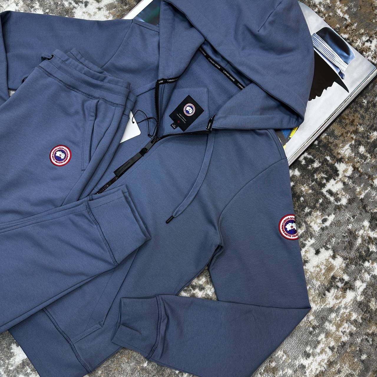 CNDA GOOSE TRACKSUIT-AAURE BLUE WITH RED BADGE